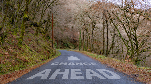 Rural Road with Change Ahead written on it