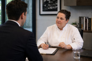 Woman chef interviewing a gentleman